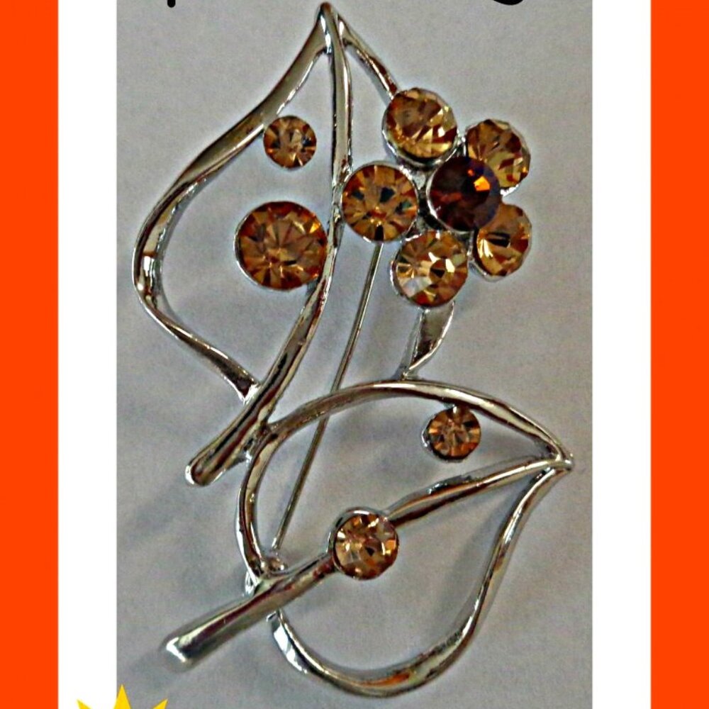 Silver Tone Flower Design Brooch With Brown Crystals